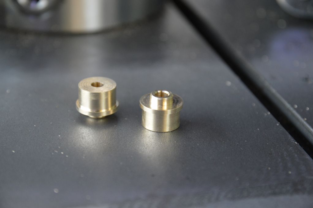 Wheel truing stand through axle hub adapters