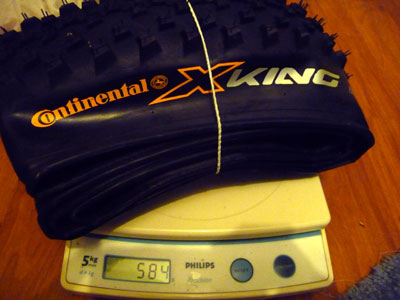 Continental X-King Racesport Tyre on scale weighing 586g