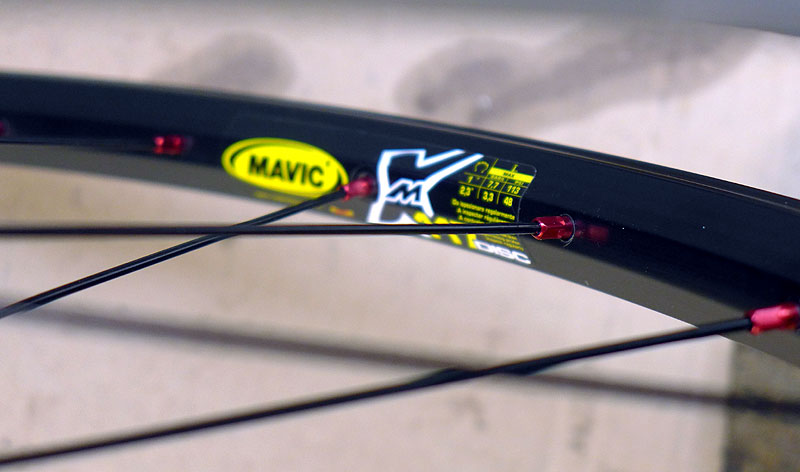 Mavic 117 rim with red aluminium nipples