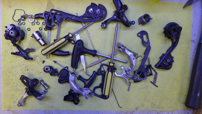 Lots of dismantled rear derailleurs