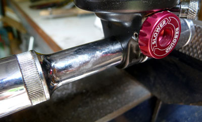 Picture of shock bushing removal using vice and 10mm and 15mm sockets